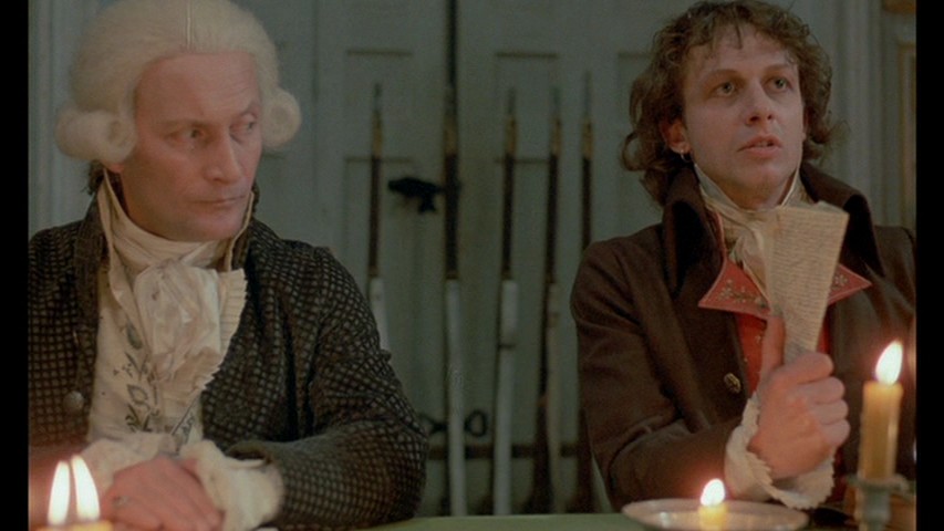 A very composed Maximilien Robespierre (Wojciech Pszoniak) and an exhaustwd, near-to-mental-breakdown Antoine Saint-Just (Boguslaw Linda) in the film Danton